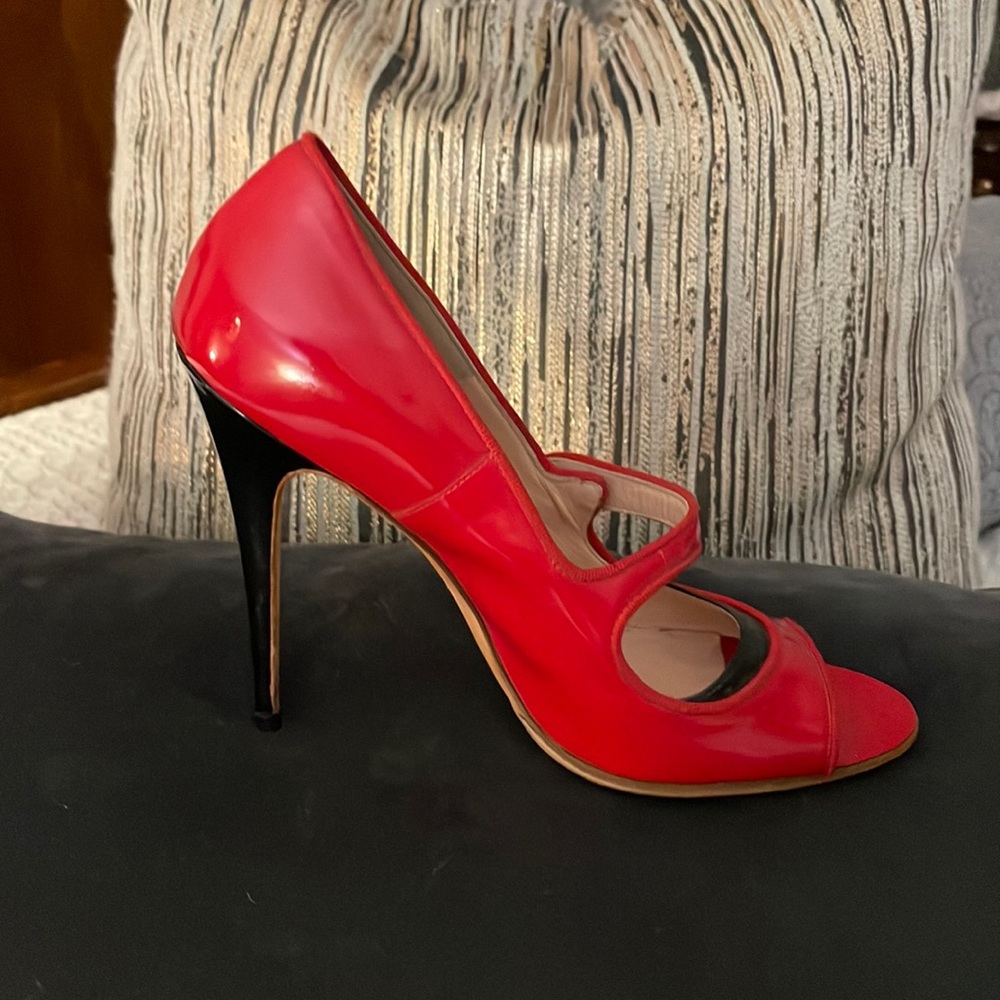 Beautiful red and black patent leather peep toe heel by Manolo Blahnik.